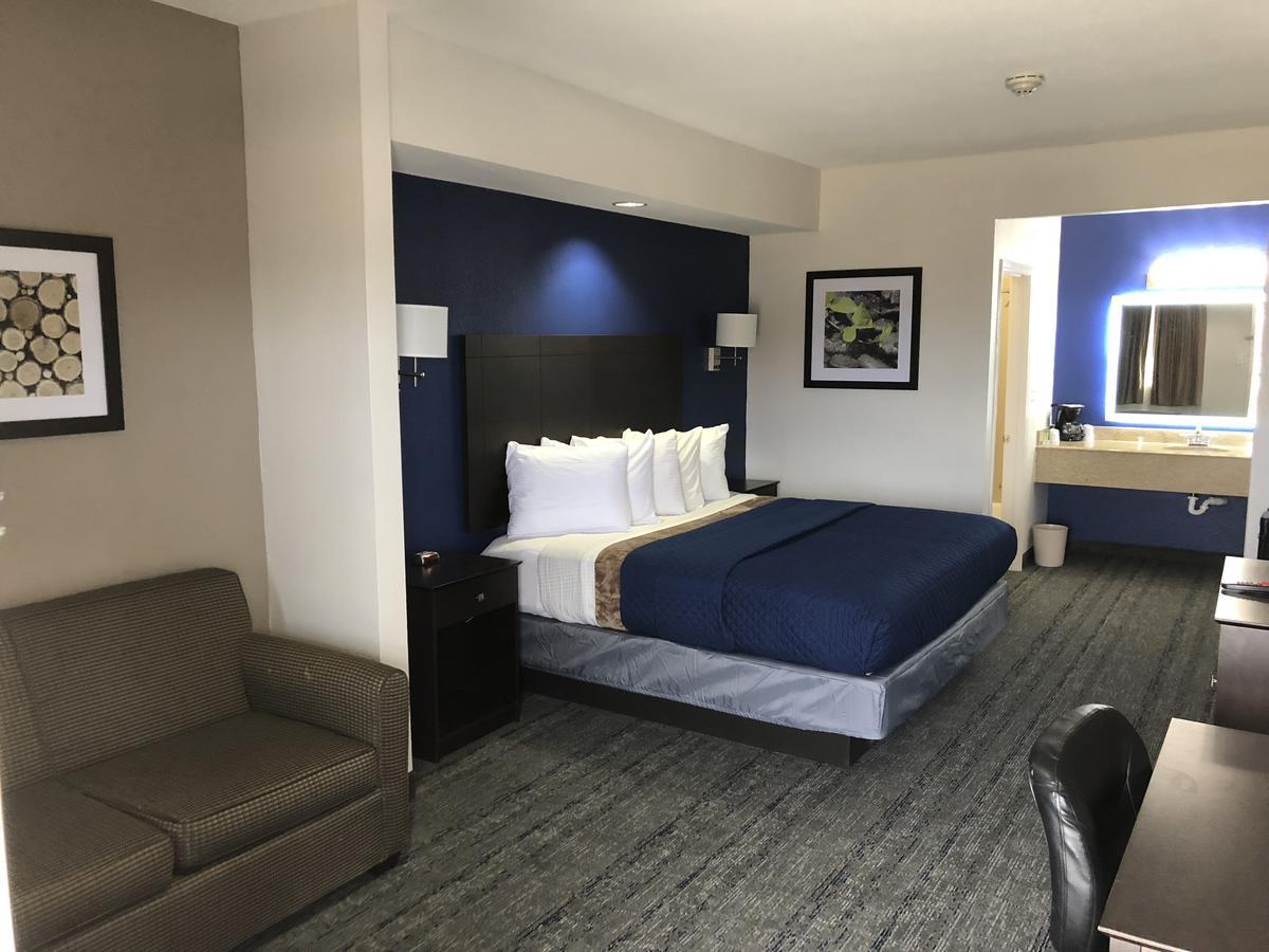 Executive Inn And Suites Joaquin Екстериор снимка